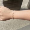 Bracelet Croix en Corde de guitare sur cordon couleur or lux SING A SONG
