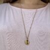 Collier doré médaillon Les Cleias